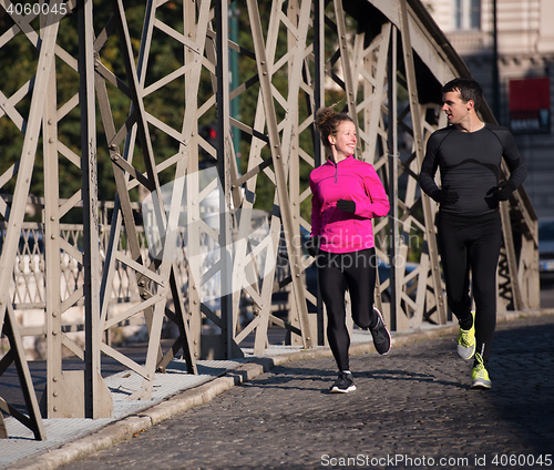 Image of young  couple jogging