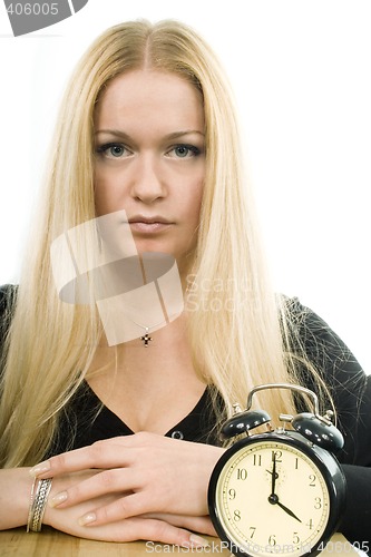 Image of blond woman with clock