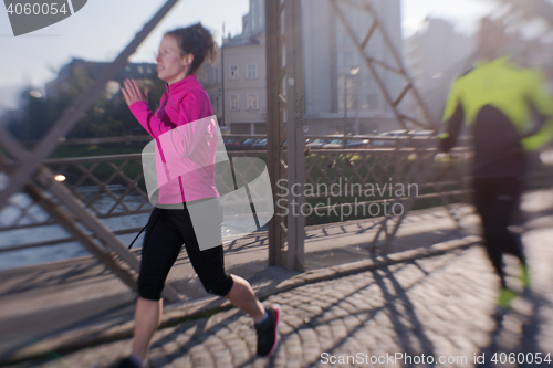 Image of young  couple jogging