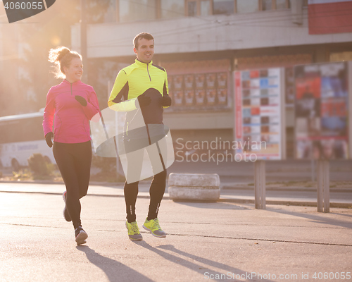 Image of young  couple jogging