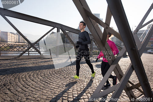 Image of young  couple jogging