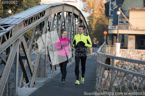 Image of young  couple jogging