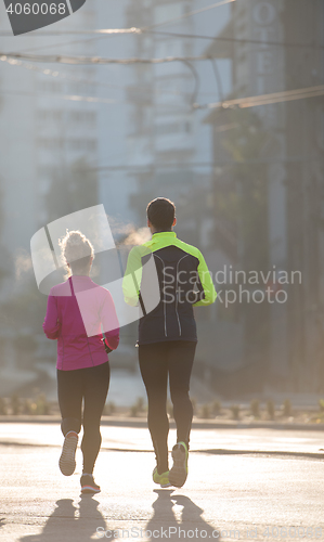 Image of young  couple jogging