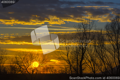 Image of Landscape Dramatic sunset and sunrise sky with a silhouette of t