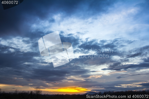 Image of Landscape Dramatic sunset and sunrise sky with a silhouette of t