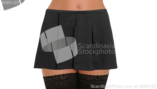 Image of Woman legs with nylons wearing skirt