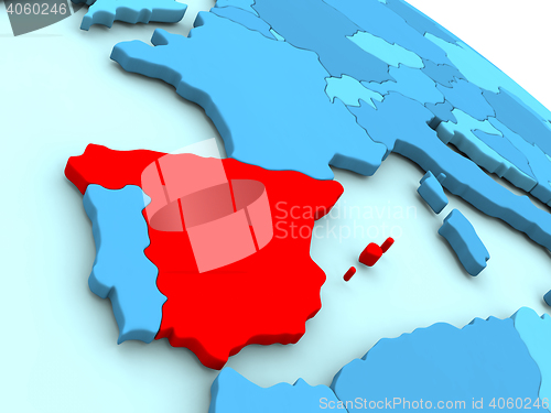 Image of Spain in red on blue globe