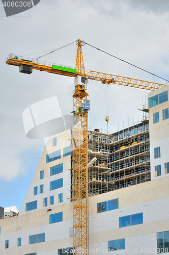 Image of Working crane on a modern office building 
