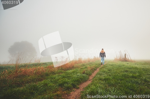 Image of Lonely young man in mysterious fog