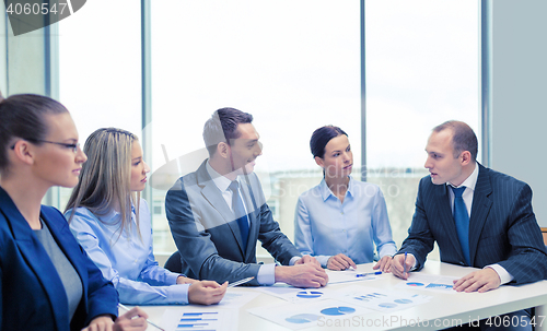 Image of smiling business team at meeting