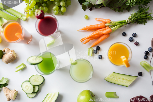 Image of glasses with different fruit or vegetable juices