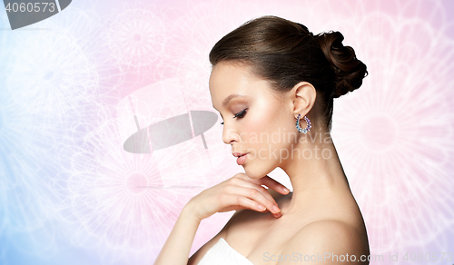 Image of close up of beautiful woman face with earring