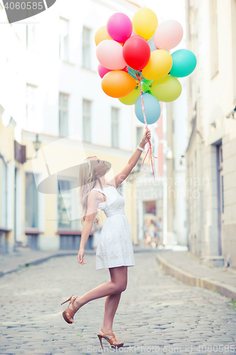 Image of woman with colorful balloons