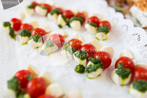 Image of close up of mozzarella and cherry tomato canape