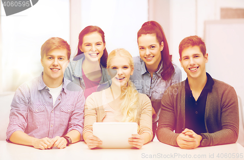 Image of smiling students with tablet pc at school