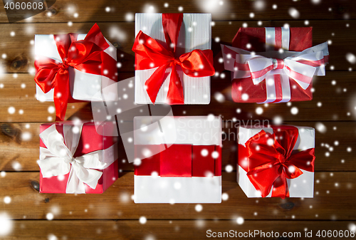 Image of close up of gift boxes on wooden floor from top