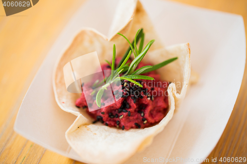 Image of close up of dough cornet with beetroot filling