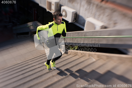Image of man jogging on steps