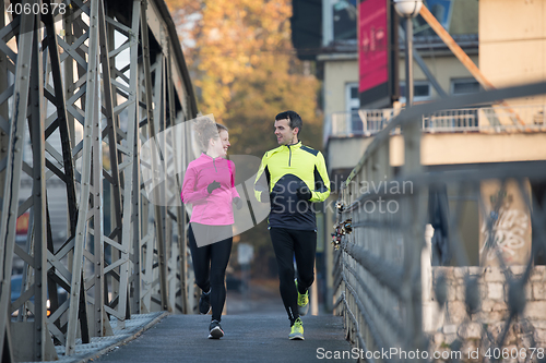 Image of young  couple jogging