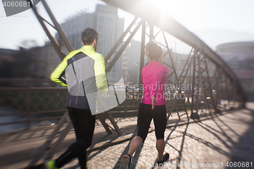 Image of young  couple jogging