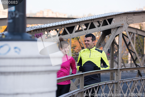 Image of young  couple jogging