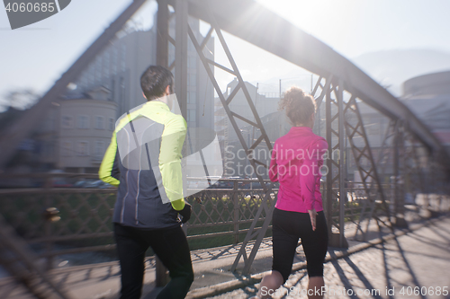 Image of young  couple jogging