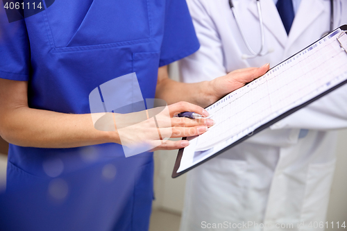 Image of close up of doctors with clipboard at hospital