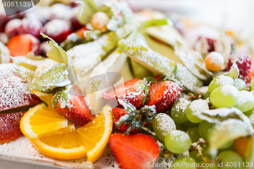 Image of close up of dish with sugared fruit dessert