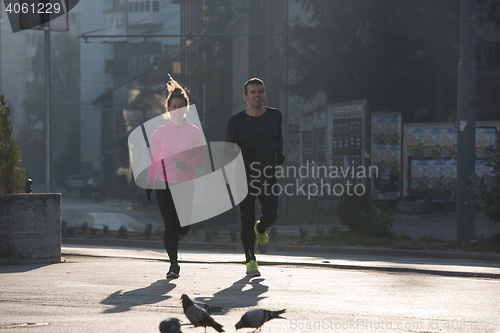 Image of young  couple jogging
