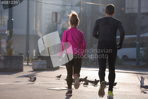 Image of young  couple jogging