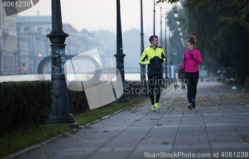 Image of young  couple jogging