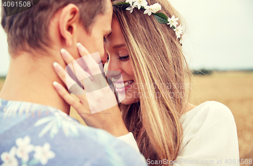 Image of happy smiling young hippie couple outdoors