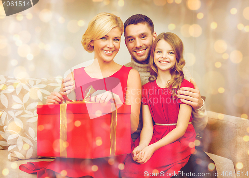 Image of happy family opening gift box