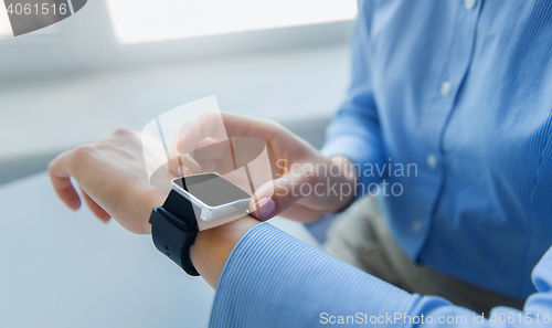 Image of close up of female hands setting smart watch