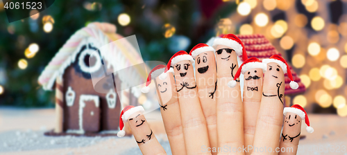 Image of close up of hands and fingers with smiley faces