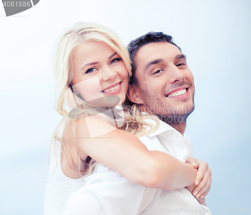 Image of couple having fun on the beach