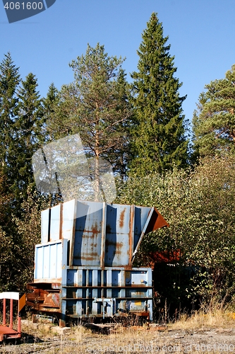 Image of Trash in autumn landscape