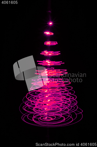 Image of christmas tree on the black background