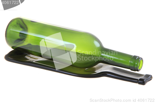 Image of green glass bottle with one flat bottle