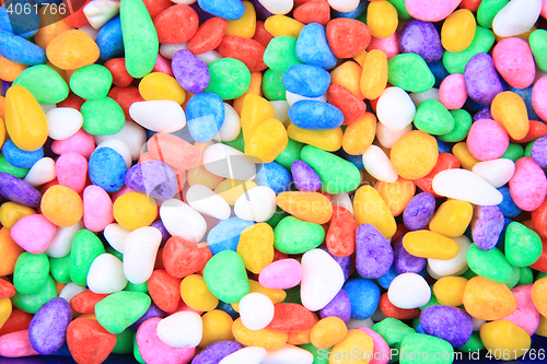 Image of boulders with plastic colors as background