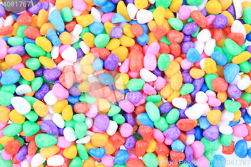 Image of boulders with plastic colors as background
