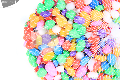 Image of boulders with plastic colors as background