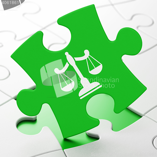 Image of Law concept: Scales on puzzle background