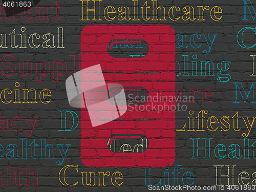 Image of Healthcare concept: Pills Blister on wall background