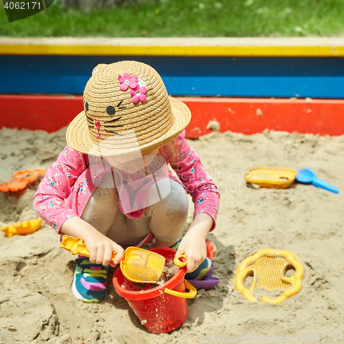 Image of Child on playground in summer park