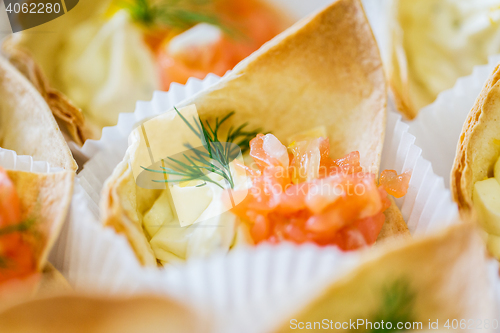 Image of close up of dough cornet with salmon fish filling