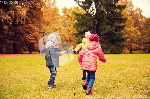 Image of group of happy little kids having fun outdoors