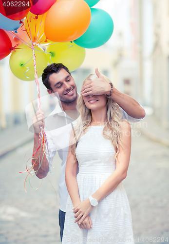 Image of couple with colorful balloons