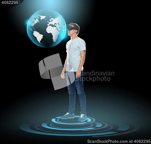 Image of happy man in virtual reality headset or 3d glasses