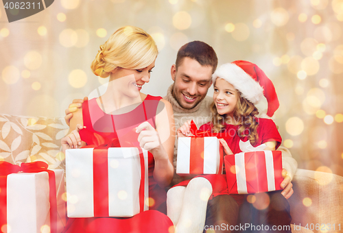 Image of happy family opening gift boxes